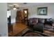 Living room with brown leather sofa and wooden accents at 749 E Yorkshire Dr, Deland, FL 32724