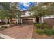 Attractive townhome with two-car garage and brick paver driveway at 8545 Couples St, Davenport, FL 33896