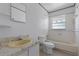 Bathroom with vintage bathtub, toilet and sink at 881 Kimball Dr, Ocoee, FL 34761