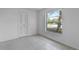 Bedroom with tiled floors, window, and closet at 881 Kimball Dr, Ocoee, FL 34761