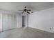 Bedroom with tiled floors, double door closet, and ceiling fan at 881 Kimball Dr, Ocoee, FL 34761