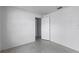 Small bedroom with tiled floors and door to hallway at 881 Kimball Dr, Ocoee, FL 34761