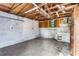 Unfinished garage with built-in cabinets and concrete floor at 881 Kimball Dr, Ocoee, FL 34761