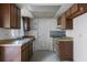 Small kitchen featuring wood cabinets and a sink at 881 Kimball Dr, Ocoee, FL 34761