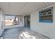 Screened porch with concrete floor and sliding glass door at 881 Kimball Dr, Ocoee, FL 34761