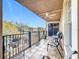 Spacious balcony featuring a ceiling fan and outdoor seating at 910 Lotus Vista Dr # 201, Altamonte Springs, FL 32714