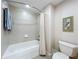 Clean bathroom with a shower/tub combo, toilet and tile flooring at 910 Lotus Vista Dr # 201, Altamonte Springs, FL 32714