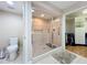 Bathroom with walk-in shower, toilet and adjacent closet at 910 Lotus Vista Dr # 201, Altamonte Springs, FL 32714