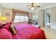 Bright bedroom with hardwood floors, king bed, and access to balcony at 910 Lotus Vista Dr # 201, Altamonte Springs, FL 32714