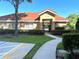 Community clubhouse with landscaping and walkway at 910 Lotus Vista Dr # 201, Altamonte Springs, FL 32714