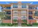 Attractive condo building with balconies and landscaping at 910 Lotus Vista Dr # 201, Altamonte Springs, FL 32714