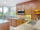 Kitchen boasts granite countertops and stainless steel appliances at 910 Lotus Vista Dr # 201, Altamonte Springs, FL 32714