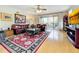 Spacious living room with hardwood floors and balcony access at 910 Lotus Vista Dr # 201, Altamonte Springs, FL 32714