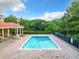 Inviting community pool surrounded by lush greenery at 910 Lotus Vista Dr # 201, Altamonte Springs, FL 32714