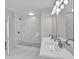 Modern bathroom with double vanity and marble shower at 923 Ferndell Rd, Orlando, FL 32808