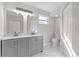 Modern bathroom with double vanity and marble shower at 923 Ferndell Rd, Orlando, FL 32808