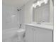 Renovated bathroom with marble tile and updated fixtures at 923 Ferndell Rd, Orlando, FL 32808