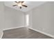 Well-lit bedroom with ceiling fan and grey flooring at 923 Ferndell Rd, Orlando, FL 32808