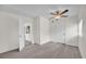 Bedroom with grey vinyl plank flooring and an open door at 923 Ferndell Rd, Orlando, FL 32808