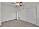 Spacious bedroom with double doors and ceiling fan at 923 Ferndell Rd, Orlando, FL 32808