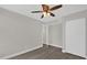 Bright bedroom with ceiling fan and wood-look floors at 923 Ferndell Rd, Orlando, FL 32808