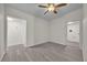 Open living area with grey wood flooring and neutral walls at 923 Ferndell Rd, Orlando, FL 32808