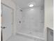 Large walk-in shower with marble tile and bench at 923 Ferndell Rd, Orlando, FL 32808