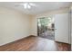 Bedroom with wood-look floors and sliding glass doors to a balcony at 95 Moonstone Ct, Port Orange, FL 32129