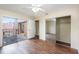 Bedroom with wood-look floors, mirrored closet doors, and balcony access at 95 Moonstone Ct, Port Orange, FL 32129