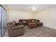 Living room with brown sectional sofa and tile floor at 95 Moonstone Ct, Port Orange, FL 32129