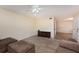 Living room with sectional sofa and wood-look tile floor at 95 Moonstone Ct, Port Orange, FL 32129