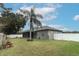 Large backyard with screened porch and palm tree at 962 Canary Lake Ct, Sanford, FL 32773