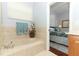 Bathroom with garden tub and view to bedroom at 962 Canary Lake Ct, Sanford, FL 32773