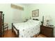 Bright bedroom with double bed and wood furniture at 962 Canary Lake Ct, Sanford, FL 32773