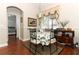 Charming dining area with round table and four chairs, and hardwood floors at 962 Canary Lake Ct, Sanford, FL 32773