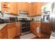 Modern kitchen featuring stainless steel appliances and light wood cabinets at 962 Canary Lake Ct, Sanford, FL 32773