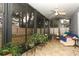 Relaxing screened porch with tiled floor and seating at 962 Canary Lake Ct, Sanford, FL 32773