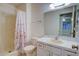Bathroom with shower/tub combo and vanity at 10738 Se 50Th Ave, Belleview, FL 34420