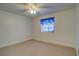 Bright bedroom with neutral walls, carpet flooring, and a ceiling fan at 10738 Se 50Th Ave, Belleview, FL 34420