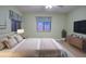 Main bedroom with TV and dresser at 10738 Se 50Th Ave, Belleview, FL 34420