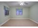 Bright bedroom with carpeted floor and ceiling fan at 10738 Se 50Th Ave, Belleview, FL 34420
