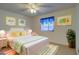 Bedroom with a queen-size bed and decor at 10738 Se 50Th Ave, Belleview, FL 34420