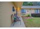 Condo exterior featuring a brick facade, patio seating, and landscaping at 10738 Se 50Th Ave, Belleview, FL 34420