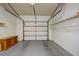 Garage with overhead door, storage shelves, and ample space at 10738 Se 50Th Ave, Belleview, FL 34420