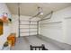 Garage with overhead door, storage shelves, and ample space at 10738 Se 50Th Ave, Belleview, FL 34420