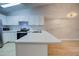 Kitchen boasts white cabinets, a breakfast bar, and stylish countertops at 10738 Se 50Th Ave, Belleview, FL 34420