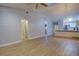 Living room with wood floors, vaulted ceiling and access to bath at 10738 Se 50Th Ave, Belleview, FL 34420