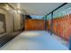 Covered patio area with wooden fence and ample space at 10738 Se 50Th Ave, Belleview, FL 34420