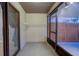 Screened patio with storage shelves and access to backyard at 10738 Se 50Th Ave, Belleview, FL 34420