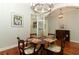 Bright dining room with hardwood floors, chandelier, and built-in hutch at 1108 S Palmetto Ave, Sanford, FL 32771